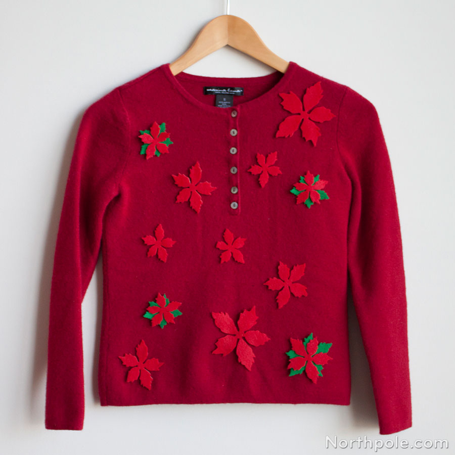 A sweet Christmas sweater with red poinsettias.